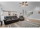 Spacious living room seamlessly flows into the kitchen area, offering an open-concept design at 7095 Evening Dew Dr, Cumming, GA 30028