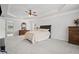 Spacious main bedroom features tray ceilings, a ceiling fan, and ample room for furniture at 7095 Evening Dew Dr, Cumming, GA 30028