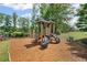 Well-equipped playground with slides, climbing structures, and soft ground cover for safety at 7095 Evening Dew Dr, Cumming, GA 30028