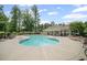 Large outdoor pool with lounge chairs and a covered pavilion area, perfect for relaxation and recreation at 7095 Evening Dew Dr, Cumming, GA 30028