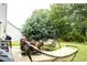 A spacious backyard perfect for outdoor relaxation with patio furniture and a swing set at 1231 St James Pl, Loganville, GA 30052