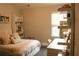 Comfortable bedroom with a cozy bed, desk, and ample shelf space, offering a serene living space at 1231 St James Pl, Loganville, GA 30052