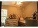 Cozy bedroom with soft lighting, a comfortable bed, and neutral color palette, perfect for relaxation at 1231 St James Pl, Loganville, GA 30052