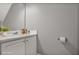 A bathroom with a white vanity, sink, and a roll of toilet paper at 132 Tara Commons Dr, Loganville, GA 30052