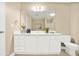 Spacious bathroom features a dual-sink vanity, large mirror, and a toilet, offering functionality at 132 Tara Commons Dr, Loganville, GA 30052