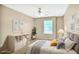 Cozy bedroom with neutral tones, ceiling fan, and natural light at 132 Tara Commons Dr, Loganville, GA 30052