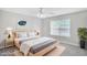 Comfortable bedroom with a large window, neutral decor, and a cozy bed at 132 Tara Commons Dr, Loganville, GA 30052