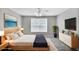 Serene bedroom with ample natural light, a comfortable bed, and stylish furnishings at 132 Tara Commons Dr, Loganville, GA 30052