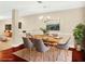 Modern dining room features a wooden table, seating for six, and hardwood floors, perfect for entertaining at 132 Tara Commons Dr, Loganville, GA 30052