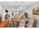Dining room with wooden table, chandelier and hardwood floors at 132 Tara Commons Dr, Loganville, GA 30052
