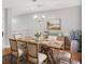 Dining room with seating for six, chandelier, and wood floors at 132 Tara Commons Dr, Loganville, GA 30052