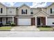 Charming townhome featuring brick accents, a single-car garage, and a welcoming front entrance at 132 Tara Commons Dr, Loganville, GA 30052