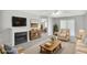 Bright living room with fireplace, neutral walls, and sliding doors at 132 Tara Commons Dr, Loganville, GA 30052