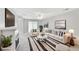 Bright living room with a fireplace, plush seating, and ample natural light at 132 Tara Commons Dr, Loganville, GA 30052
