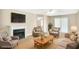 Inviting living room showcases a fireplace, plush seating arrangement, and neutral decor for a comfortable space at 132 Tara Commons Dr, Loganville, GA 30052