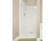 Modern walk-in shower with sleek fixtures and pristine white surround at 132 Tara Commons Dr, Loganville, GA 30052