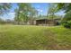Expansive backyard with lush green grass and mature trees at 1447 High Sierra Dr, Lawrenceville, GA 30043