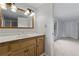 Bathroom features a vanity, sink, mirror, and decorative lighting at 1447 High Sierra Dr, Lawrenceville, GA 30043