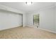 Cozy bedroom with a closet, neutral paint, a window, and tile floors at 1447 High Sierra Dr, Lawrenceville, GA 30043