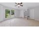 Cozy bedroom featuring tile flooring, a ceiling fan, and ample closet space at 1447 High Sierra Dr, Lawrenceville, GA 30043