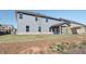 Backyard of a two-story home with a covered patio and large yard at 2436 Cadenza Cir, Dacula, GA 30019