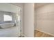 View of a luxurious bathroom featuring a soaking tub, marble floors, and a walk-in closet at 2436 Cadenza Cir, Dacula, GA 30019