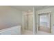 Bathroom features a walk-in marble shower, neutral paint and a glass door at 2436 Cadenza Cir, Dacula, GA 30019