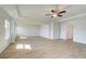 Spacious bedroom with a ceiling fan and wood floors, creating a cozy and stylish space at 2436 Cadenza Cir, Dacula, GA 30019