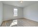 A bedroom with wood floors and a window at 2436 Cadenza Cir, Dacula, GA 30019