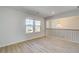 Bedroom showing natural light and wood floors, creating an open and airy feel at 2436 Cadenza Cir, Dacula, GA 30019