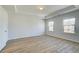 Bedroom features a tray ceiling and two windows offering natural light and neighborhood views at 2436 Cadenza Cir, Dacula, GA 30019
