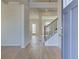 Bright foyer with hardwood floors, a staircase with black iron railings, and an open floor plan at 2436 Cadenza Cir, Dacula, GA 30019