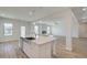 Modern kitchen island featuring a sink, dishwasher, and ample counter space at 2436 Cadenza Cir, Dacula, GA 30019