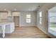 Bright and airy dining area features wood floors, lots of windows, and leads to a modern kitchen at 2436 Cadenza Cir, Dacula, GA 30019