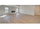 Bright and airy living room with wood floors and a modern fireplace at 2436 Cadenza Cir, Dacula, GA 30019