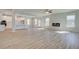 An open floor plan living space with hard wood flooring, recessed lighting, and an electric fireplace at 2436 Cadenza Cir, Dacula, GA 30019