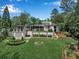 Expansive backyard showcasing a pool, manicured lawn, and elegant landscaping at 3625 Tuxedo Nw Rd, Atlanta, GA 30305