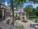 Expansive backyard with a patio, lush landscaping, and an outdoor dining area at 3625 Tuxedo Nw Rd, Atlanta, GA 30305