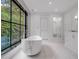 Spacious bathroom with a modern soaking tub and glass shower at 3625 Tuxedo Nw Rd, Atlanta, GA 30305