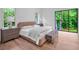 Cozy bedroom with hardwood floors, large window, and elegant furnishings at 3625 Tuxedo Nw Rd, Atlanta, GA 30305