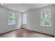 Bright bedroom features hardwood floors, large windows, and recessed lighting at 3625 Tuxedo Nw Rd, Atlanta, GA 30305
