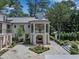 Elegant courtyard with a water feature, fireplace, and manicured landscaping at 3625 Tuxedo Nw Rd, Atlanta, GA 30305