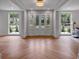 Bright and airy foyer with herringbone-patterned hardwood floors and a grand entrance with large windows at 3625 Tuxedo Nw Rd, Atlanta, GA 30305