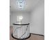 Hallway with decorative lighting and a curved staircase at 3625 Tuxedo Nw Rd, Atlanta, GA 30305