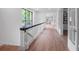 Hallway with hardwood floors, white wainscoting, and elegant architectural details at 3625 Tuxedo Nw Rd, Atlanta, GA 30305