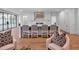 Modern kitchen featuring a large island with seating, state-of-the-art appliances, and hardwood flooring at 3625 Tuxedo Nw Rd, Atlanta, GA 30305