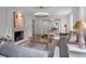 Comfortable living room features a fireplace, hardwood floors, modern lighting and sunny window views at 3625 Tuxedo Nw Rd, Atlanta, GA 30305