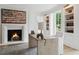 Inviting office features a fireplace, a modern desk, and custom built-in shelving at 3625 Tuxedo Nw Rd, Atlanta, GA 30305