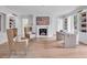 Spacious home office with a fireplace, shelving, and plenty of natural light at 3625 Tuxedo Nw Rd, Atlanta, GA 30305