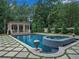 Backyard featuring a pristine pool, a hot tub, and a gazebo surrounded by mature landscaping at 3625 Tuxedo Nw Rd, Atlanta, GA 30305